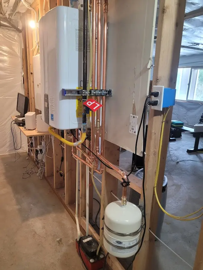 Licensed plumber repairing a kitchen sink in Anna